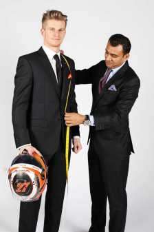 Master Tailor take measurements F1 Driver for their Suits